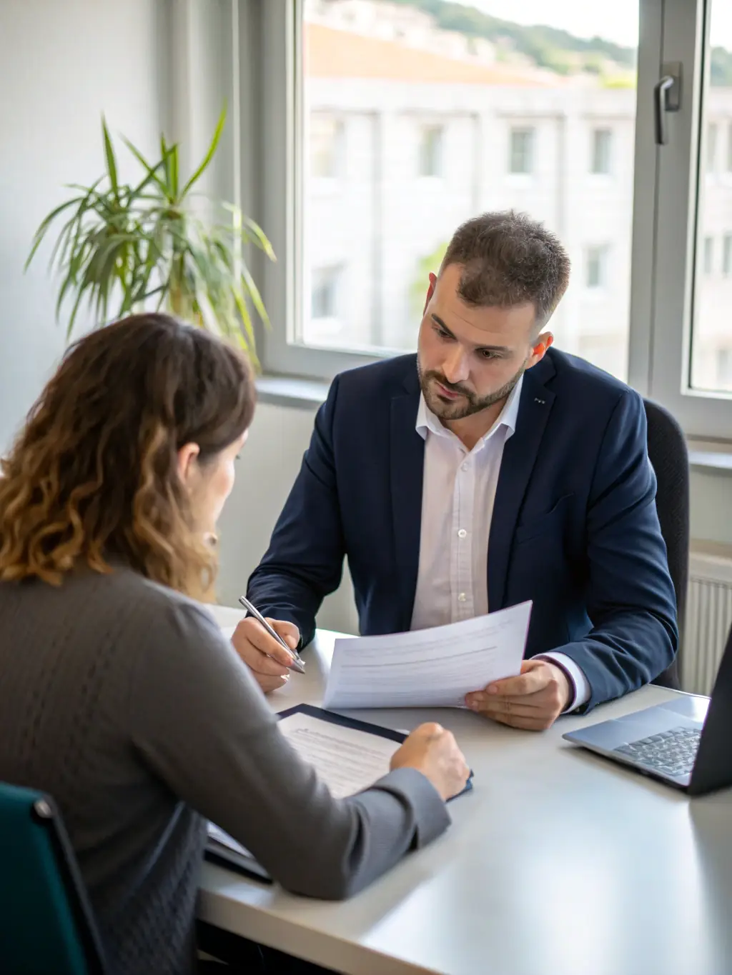 A consultant giving career advice to a candidate in a modern office setting, emphasizing guidance and support in career development.